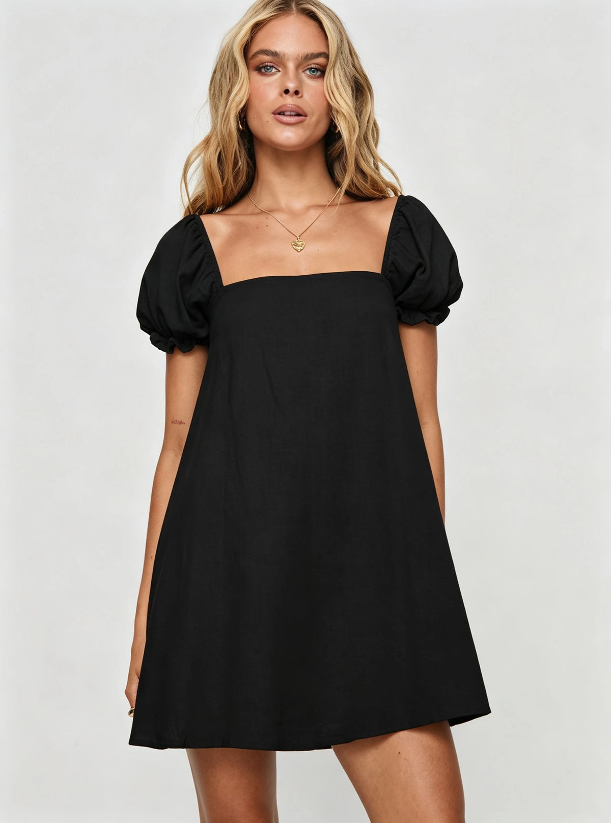 Black women's short spring and summer dress by Corporación Turística, lightweight and casual for warm weather.