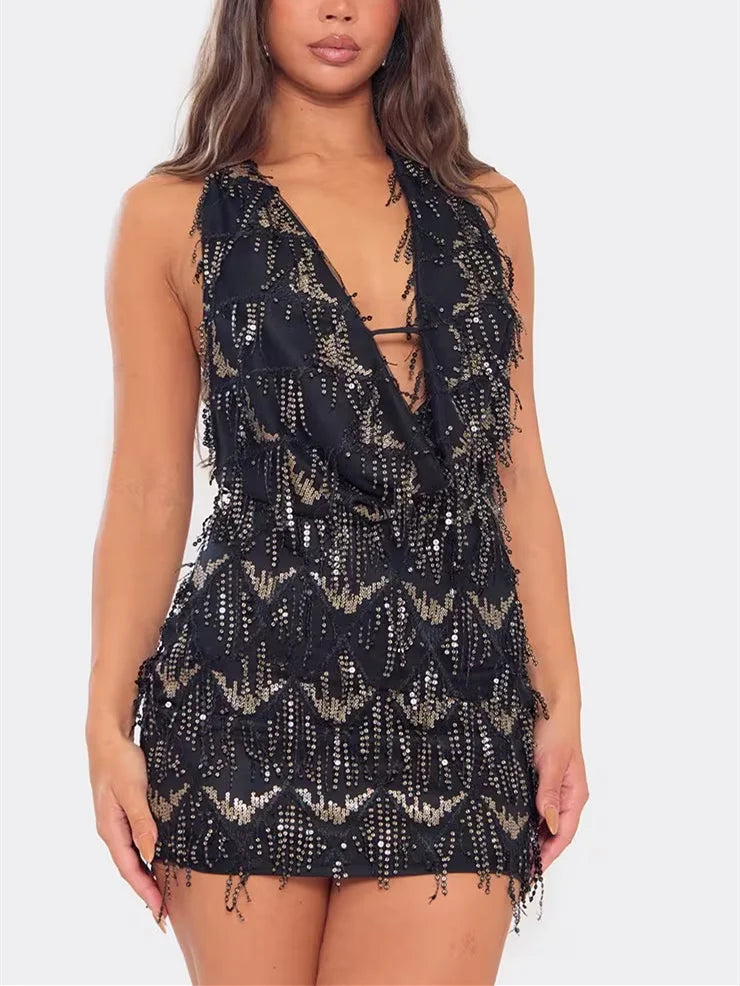 Black mini halter dress with sequins for women, featuring a high neckline and fitted silhouette, from Corporación Turística.