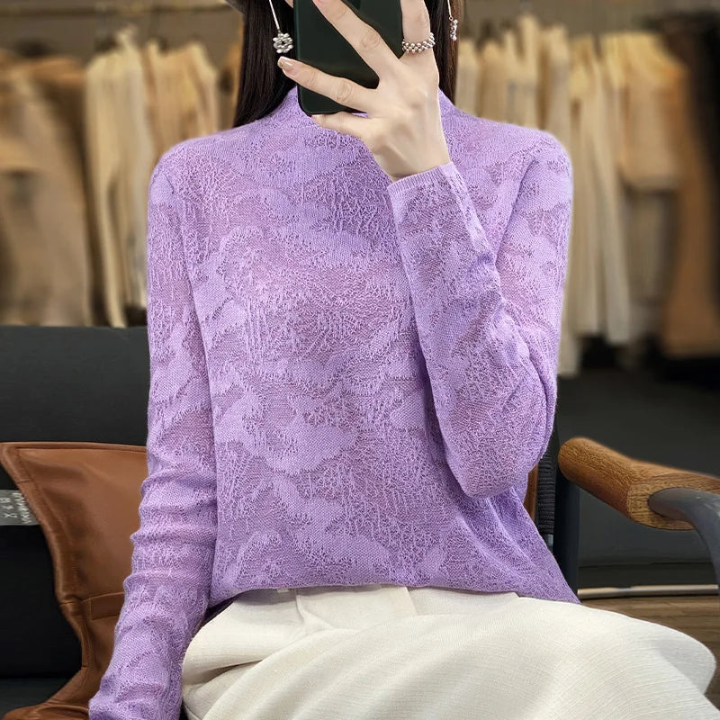 Black wool knit winter sweater with a high collar, designed by Corporación Turística, featuring a cozy and stylish look.