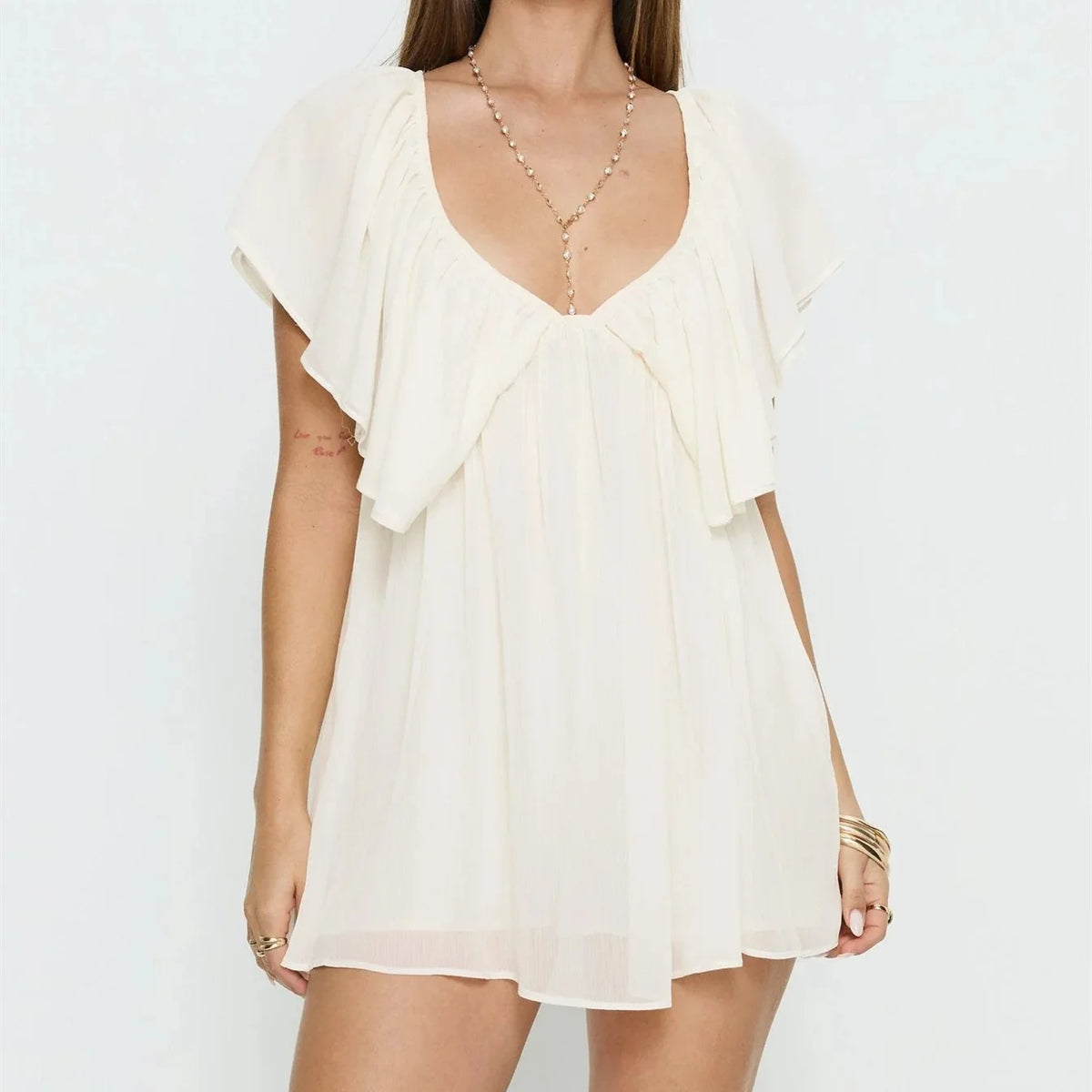 Black summer dress for women, casual mini dress with ruffle details, from Corporación Turística, suitable for warm weather.