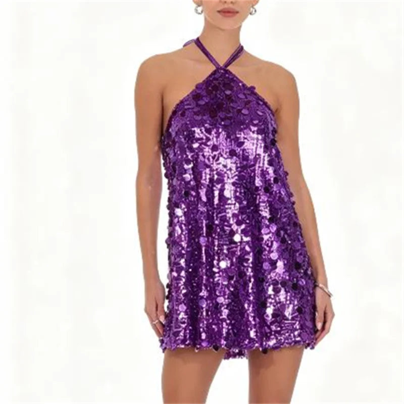 Black mini halter dress with sequins for women, stylish party wear from Corporación Turística, shown on a female model.