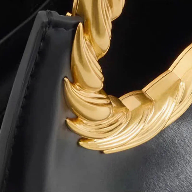 Luxury black women's handbag from Nuevo Diseño 2026 by Corporación Turística, featuring elegant design and premium craftsmanship.