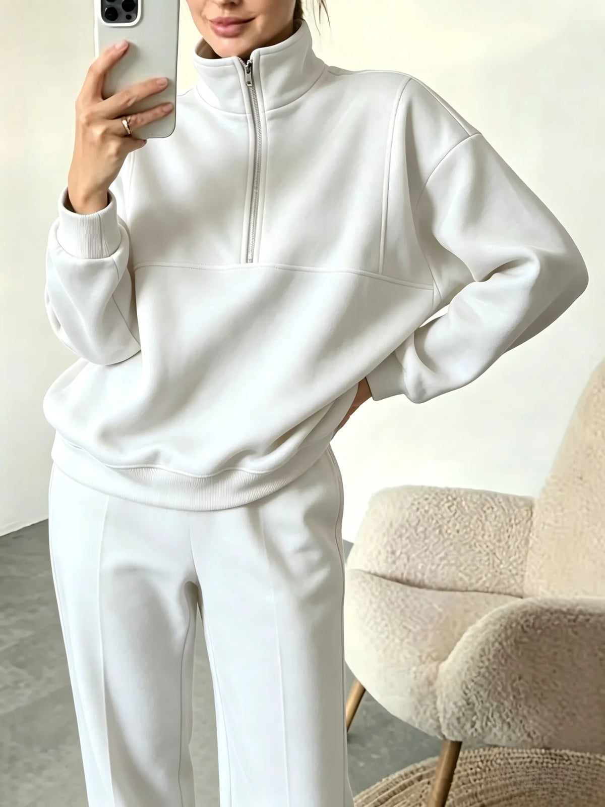Black sweat suit set with half-zip sweatshirt and matching pants from Corporación Turística, casual and comfortable for everyday wear.