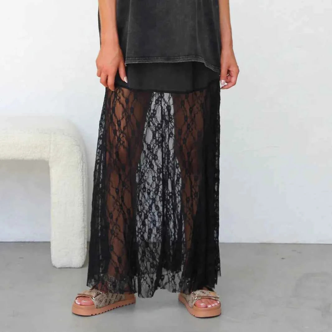 Black boho summer long skirt for women with lace details, flowing design, ideal for casual and beachwear.