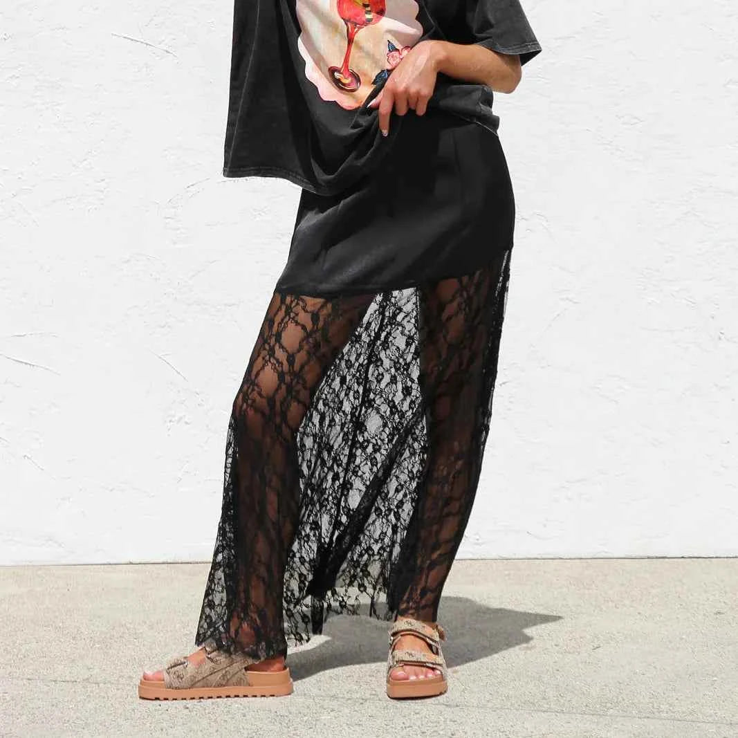 Long boho summer skirt for women with lace details, black fabric, flowing style, from Corporación Turística.