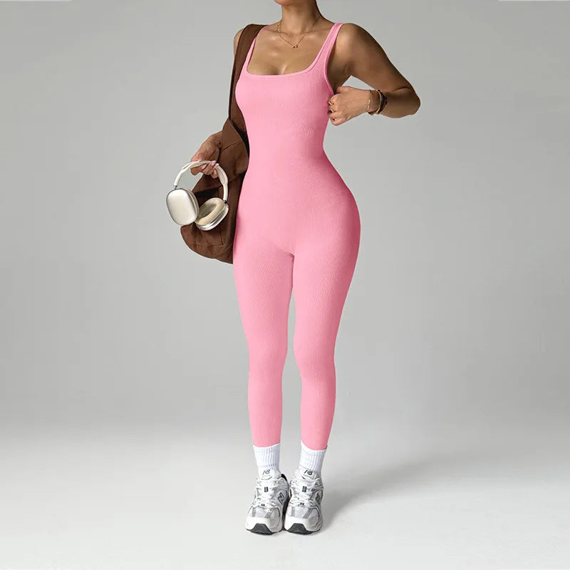 Black women's one-piece seamless sports jumpsuit by Corporación Turística, designed for activewear and comfortable fit.