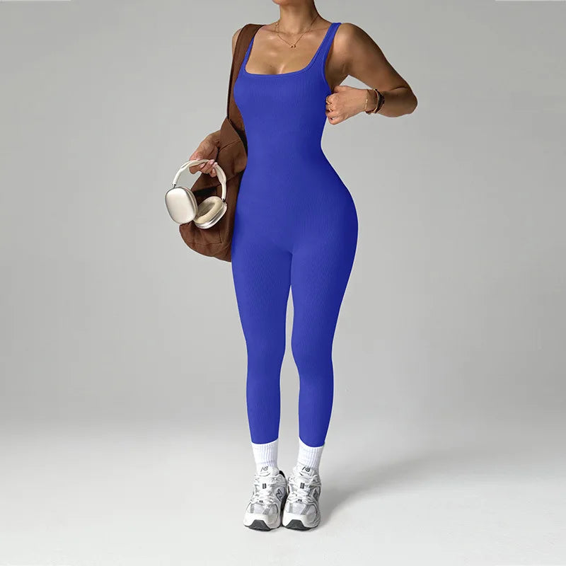 Black women's one-piece sports jumpsuit by Corporación Turística, seamless design, form-fitting athletic apparel.