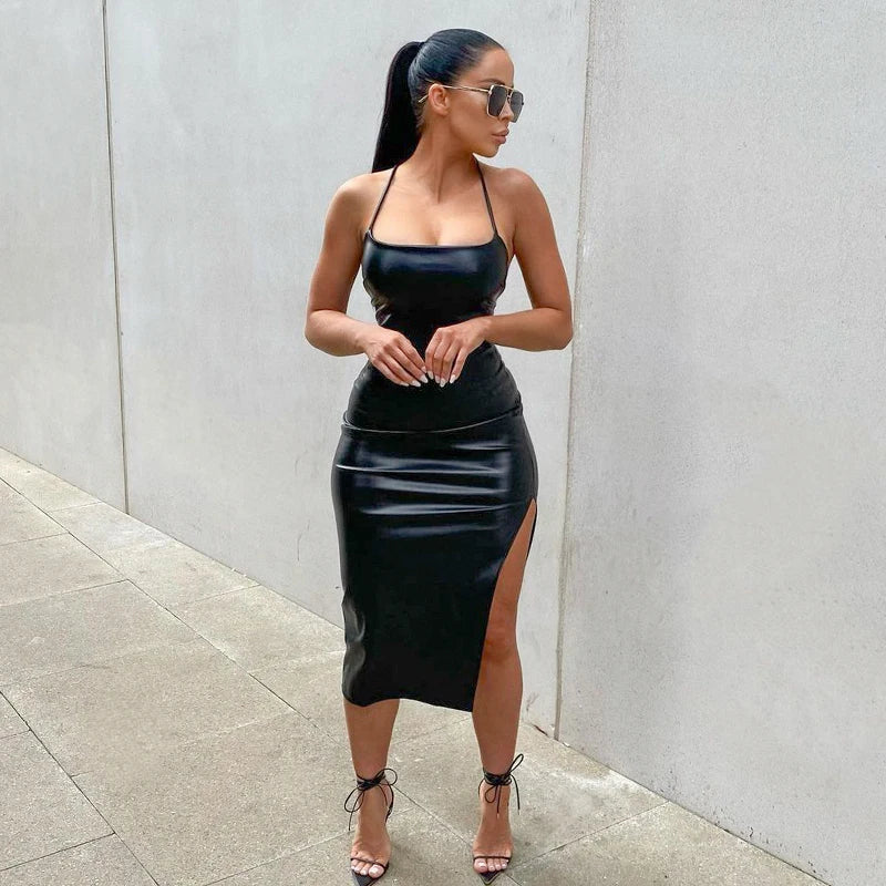 Black fitted midi dress with spaghetti straps for women, from Corporación Turística, shown on a model.
