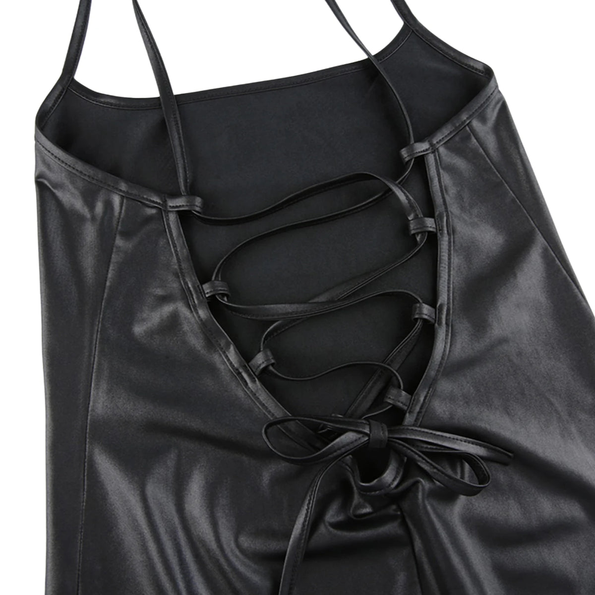 Black medium-length fitted dress with spaghetti straps for women, by Corporación Turística, shown on a model.