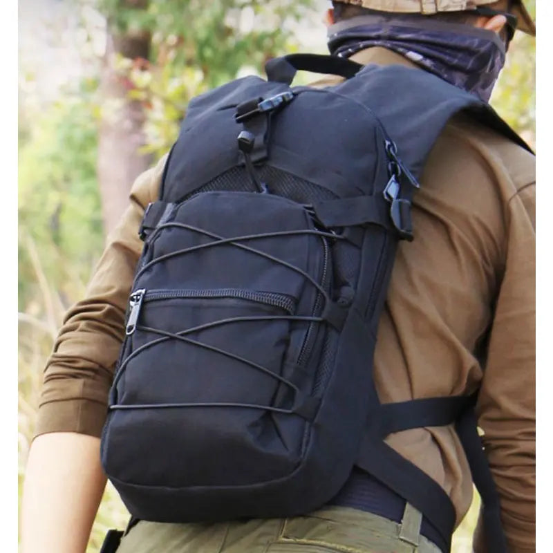 Tactical Molle backpack 15L by Corporación Turística, designed for biking, with multiple compartments and adjustable straps.
