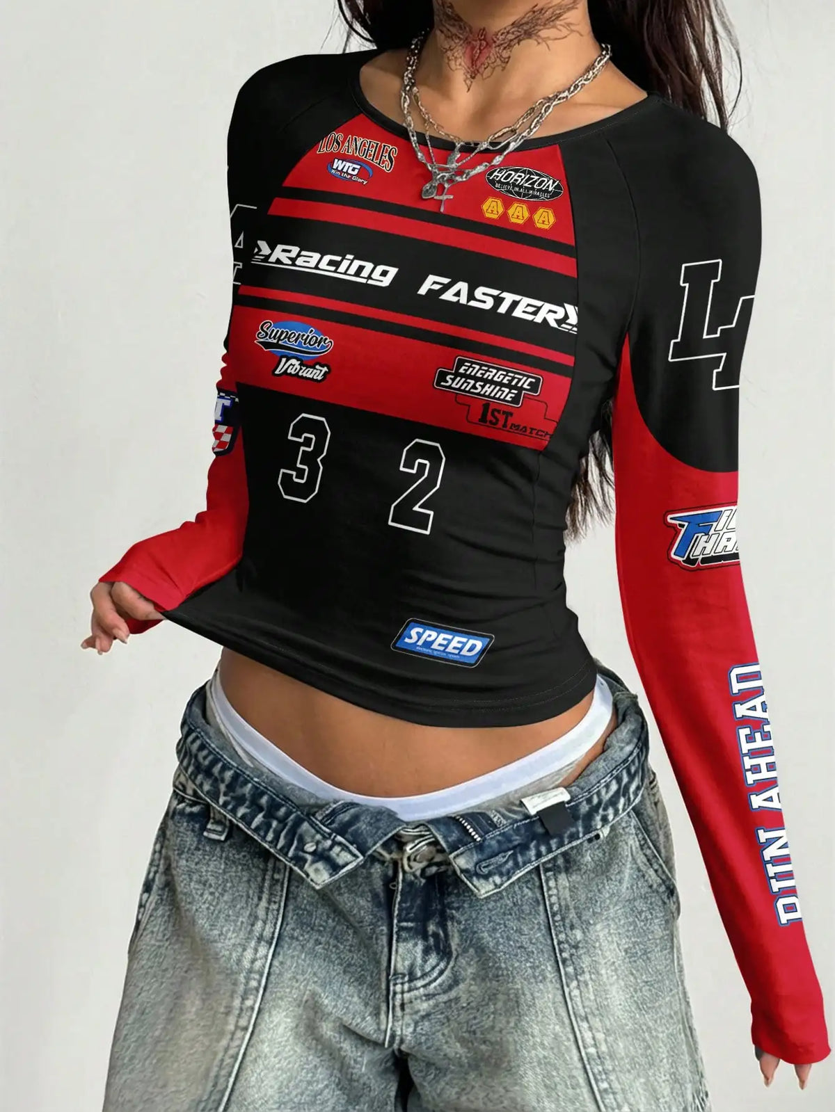 Gray raglan sleeve T-shirt with bold motorcycle graphic print, featuring the Corporación Turística brand logo on the front.