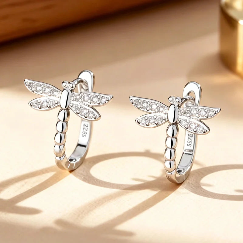 Silver S925 hoop earrings with dragonfly and gemstone accents, featuring intricate design and polished finish.
