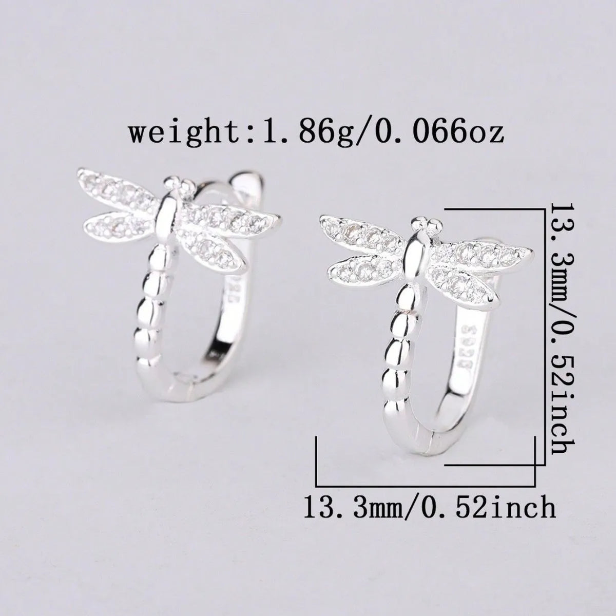 Silver S925 hoop earrings with intricate dragonfly and circle designs, crafted by Corporación Turística.
