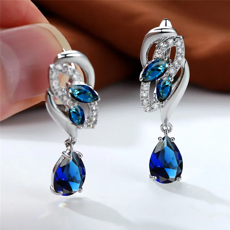 Elegant blue rainbow stone luxury earring for women featuring a silver setting, showcasing vibrant, multicolored gemstone details.