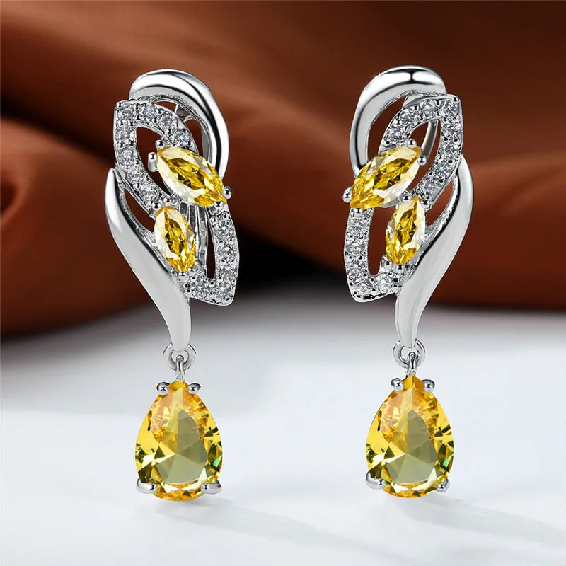 Blue rainbow stone luxury hoop earring for women with olive-green accents, elegant jewelry by Corporación Turística.
