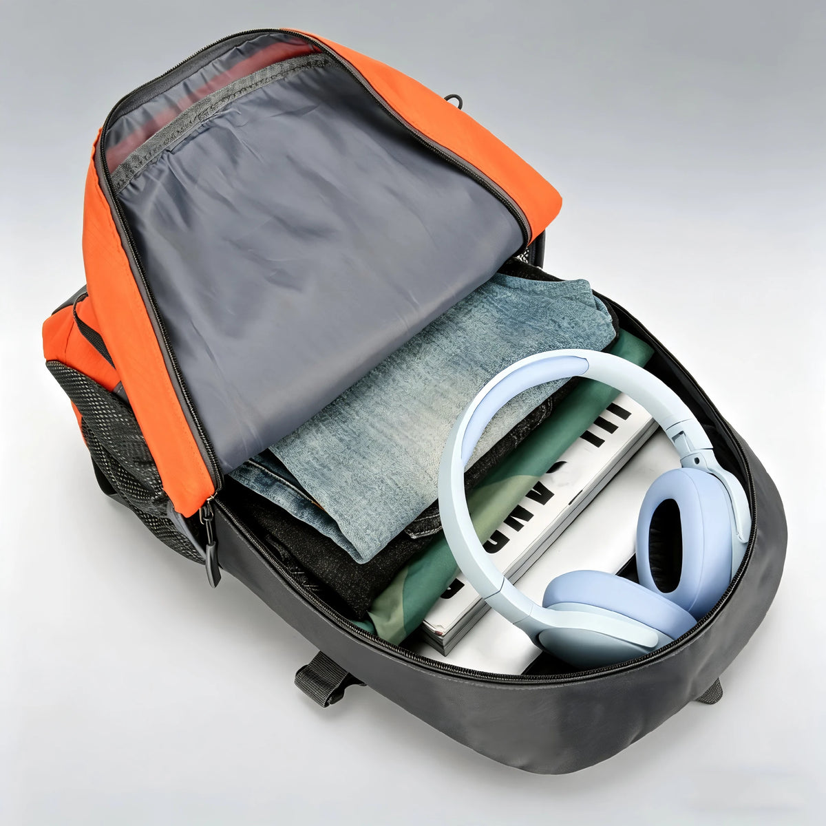 Orange OGEHUAFEE hiking backpack from Corporación Turística, showing multiple compartments and adjustable straps for outdoor adventures.