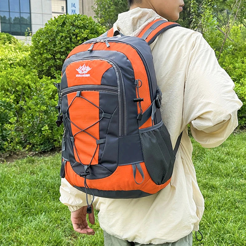 Orange multifunctional hiking backpack by OGEHUAFEE, featuring multiple compartments, suitable for outdoor adventures and travel.