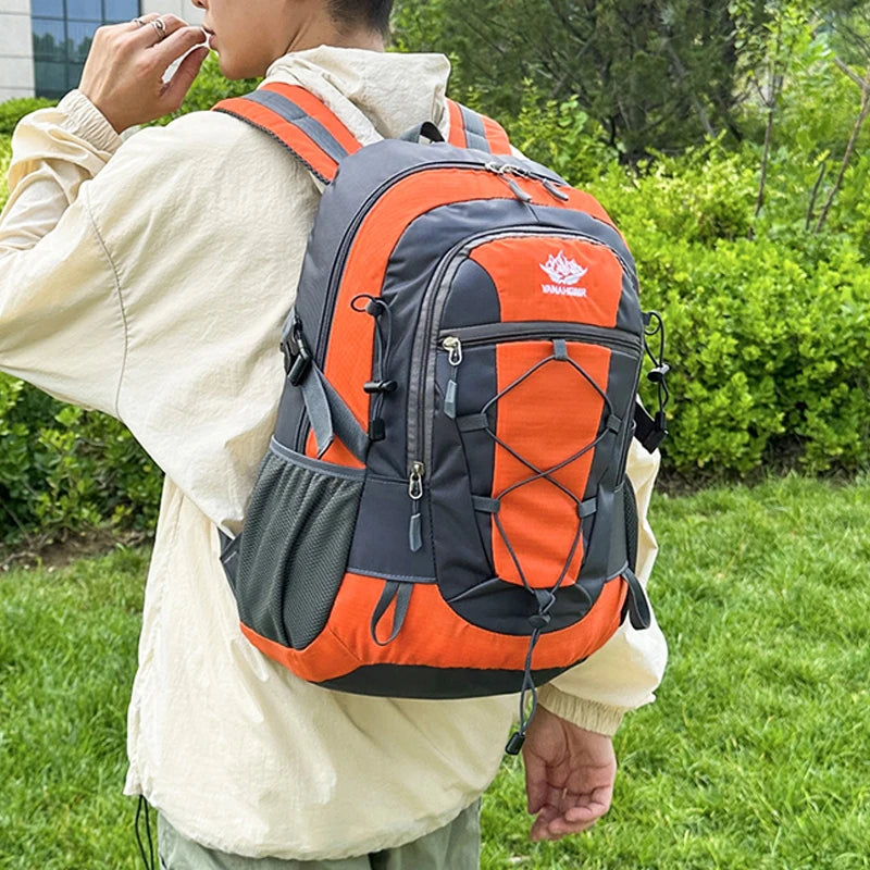 Orange OGEHUAFEE multifunctional hiking backpack by Corporación Turística, showing multiple compartments and adjustable straps.