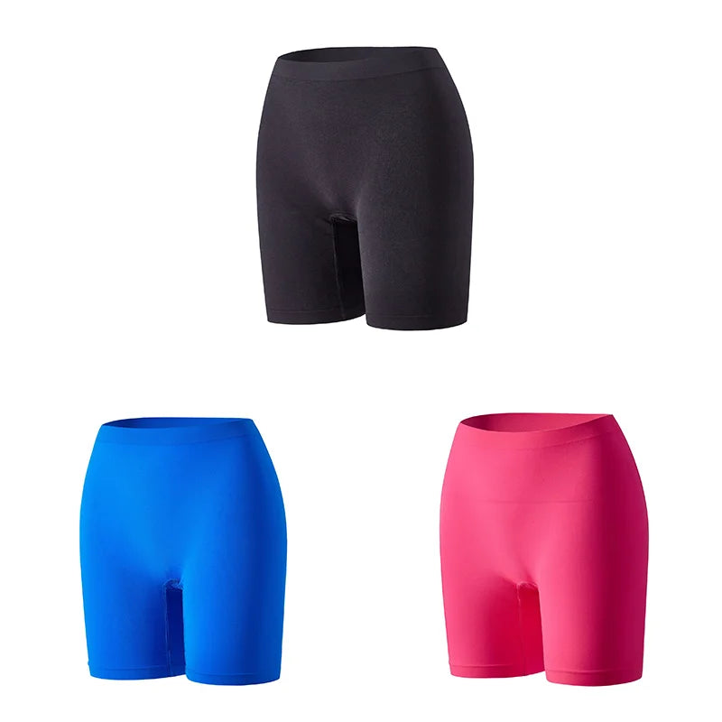 Set of three orange women's safety shorts from Corporación Turística, featuring durable fabric and adjustable waistbands.