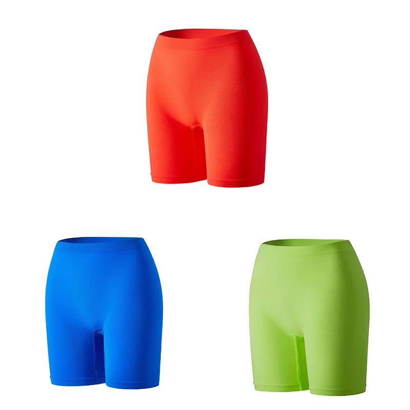 Set of three orange women's safety shorts with reflective strips, made by Corporación Turística, designed for safety and visibility.
