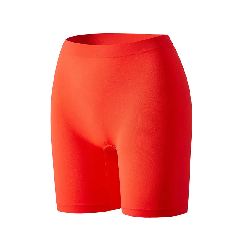Three pairs of orange women's security shorts from Corporación Turística, displayed on a plain background.