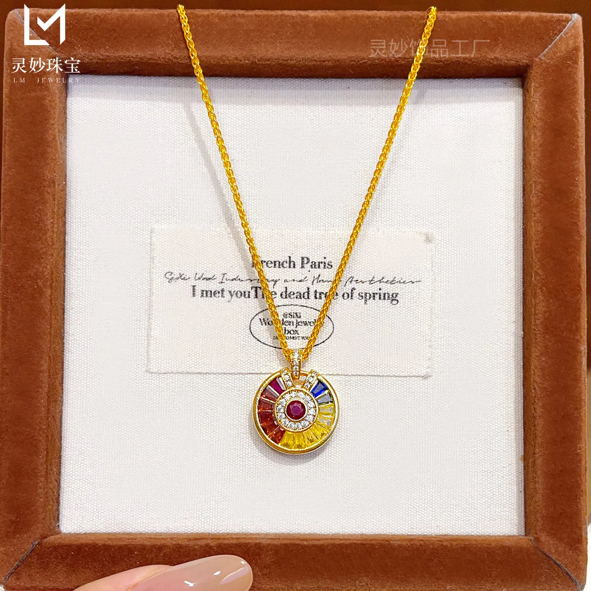Luxurious gold necklace with rainbow disco pendant from Corporación Turística, detailed close-up of the elegant jewelry piece.