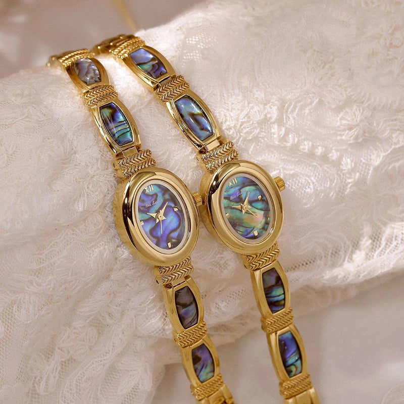 Elegant women's oval dial wristwatch by Corporación Turística with a gold-tone strap and matching case.