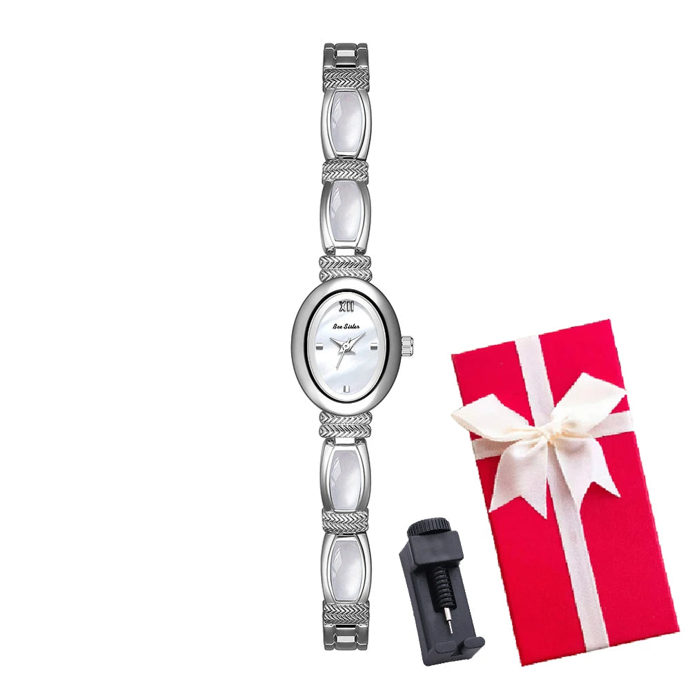 Gold oval-faced women's wristwatch by Corporación Turística with elegant design and matching jewelry box.