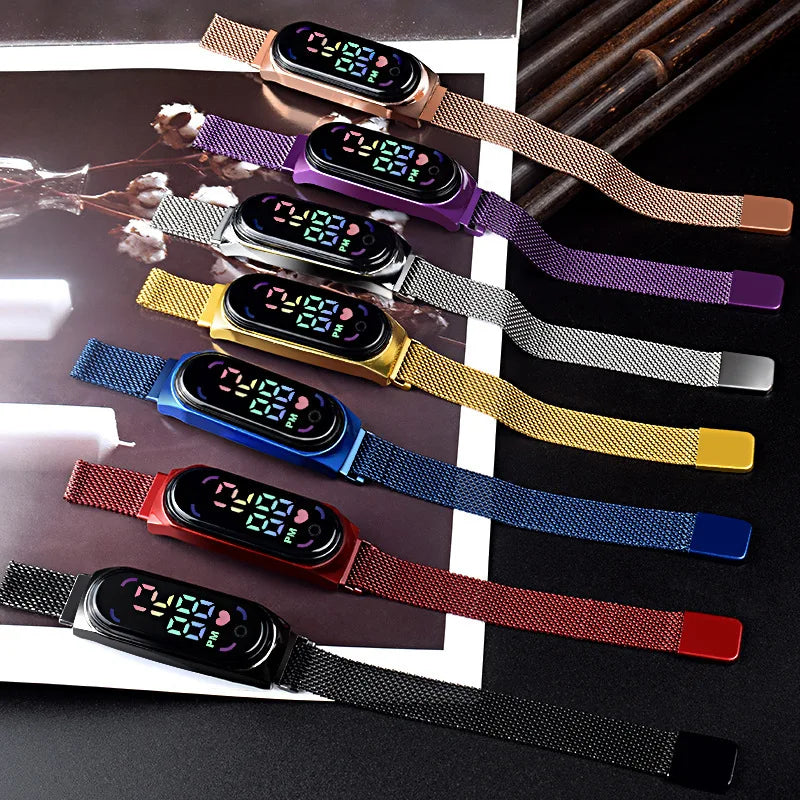 Gold LED magnetic electronic watch with alloy bracelet from Corporación Turística, featuring a modern digital display.
