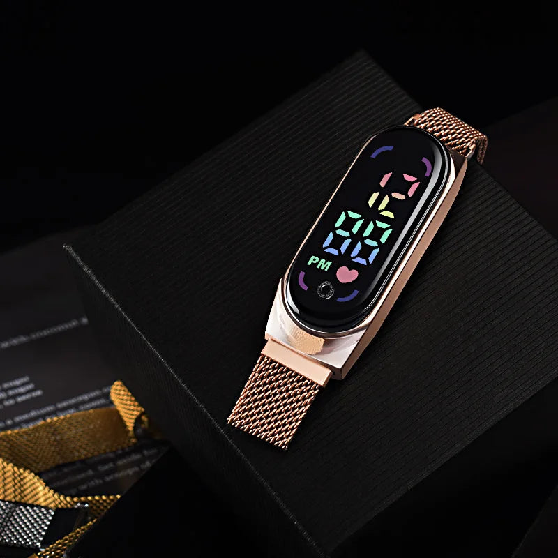 Gold LED magnetic electronic watch with alloy bracelet from Corporación Turística, featuring a sleek modern design.