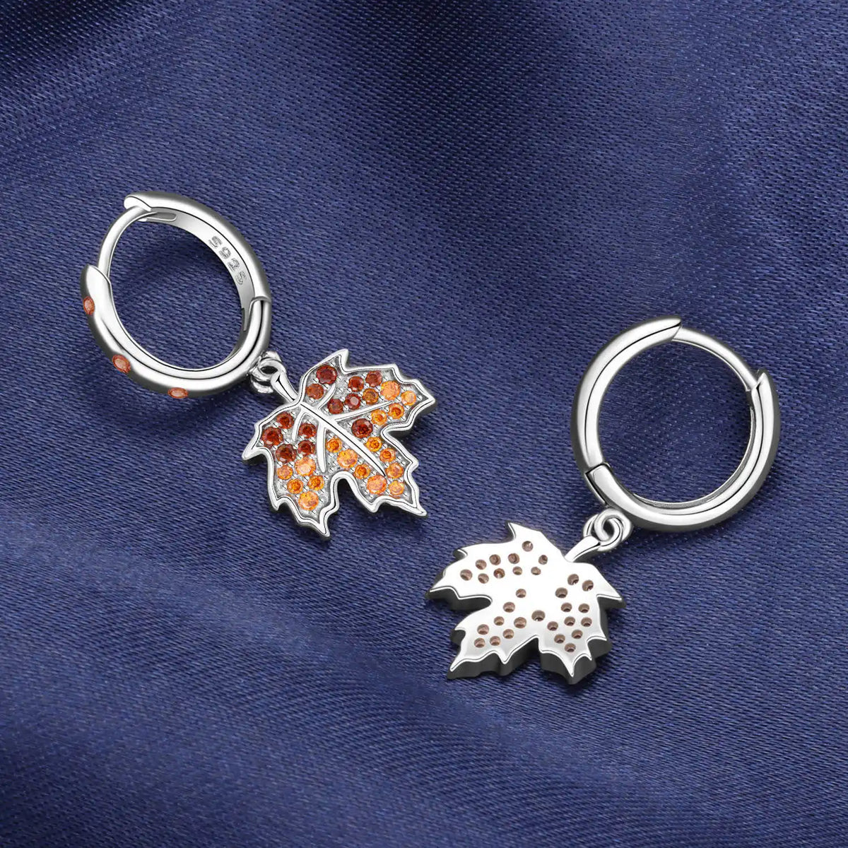 Sterling silver earrings with blue hydrangea flower design, featuring floral details and elegant craftsmanship.