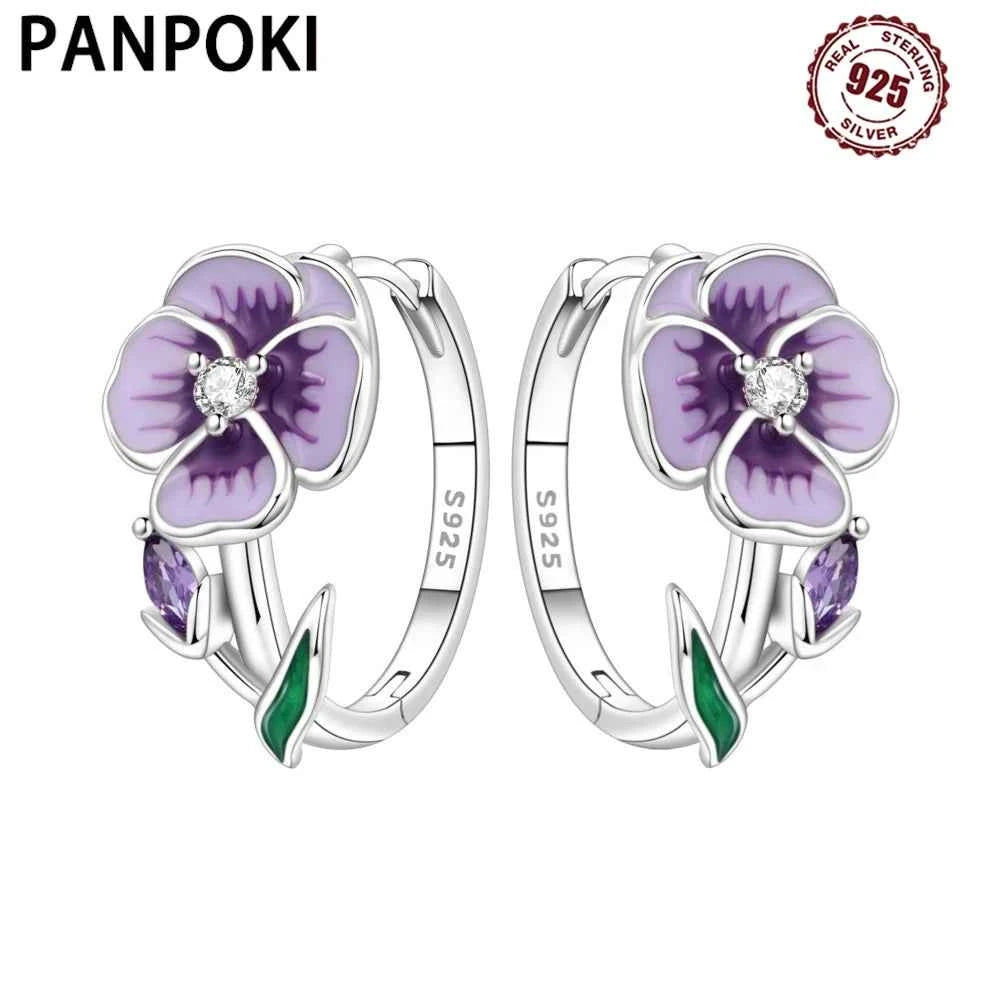 Sterling silver PANPOKI flower-shaped earrings by Corporación Turística, showcasing intricate floral design and shiny silver finish.