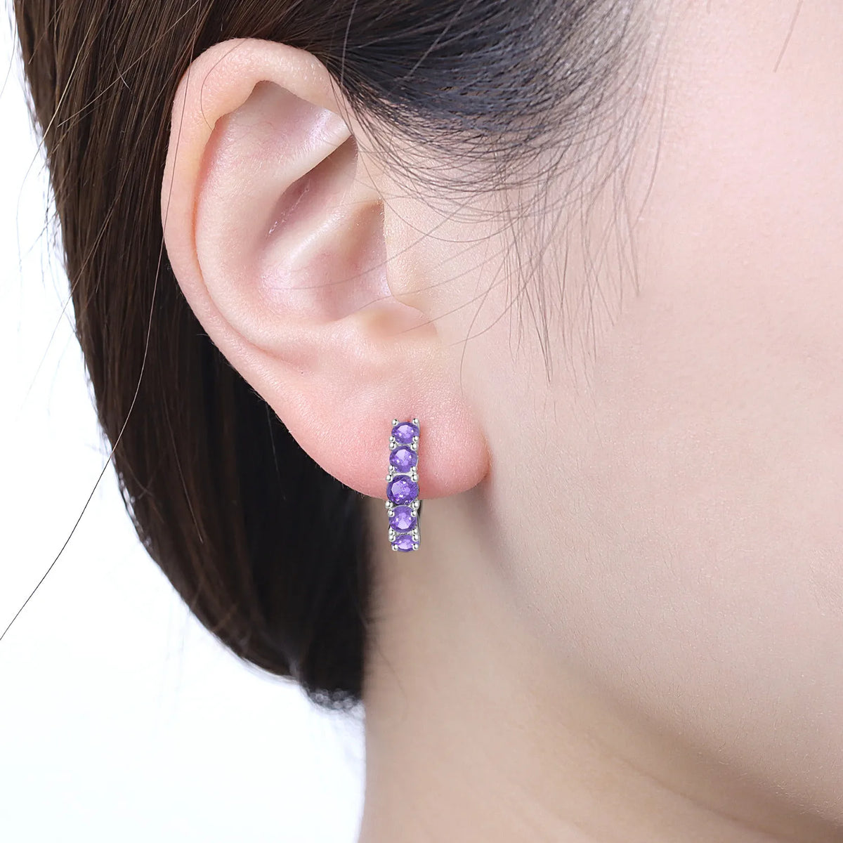 Colorful zirconia earrings from PANPOKI collection featuring simplified, vibrant design by Corporación Turística.