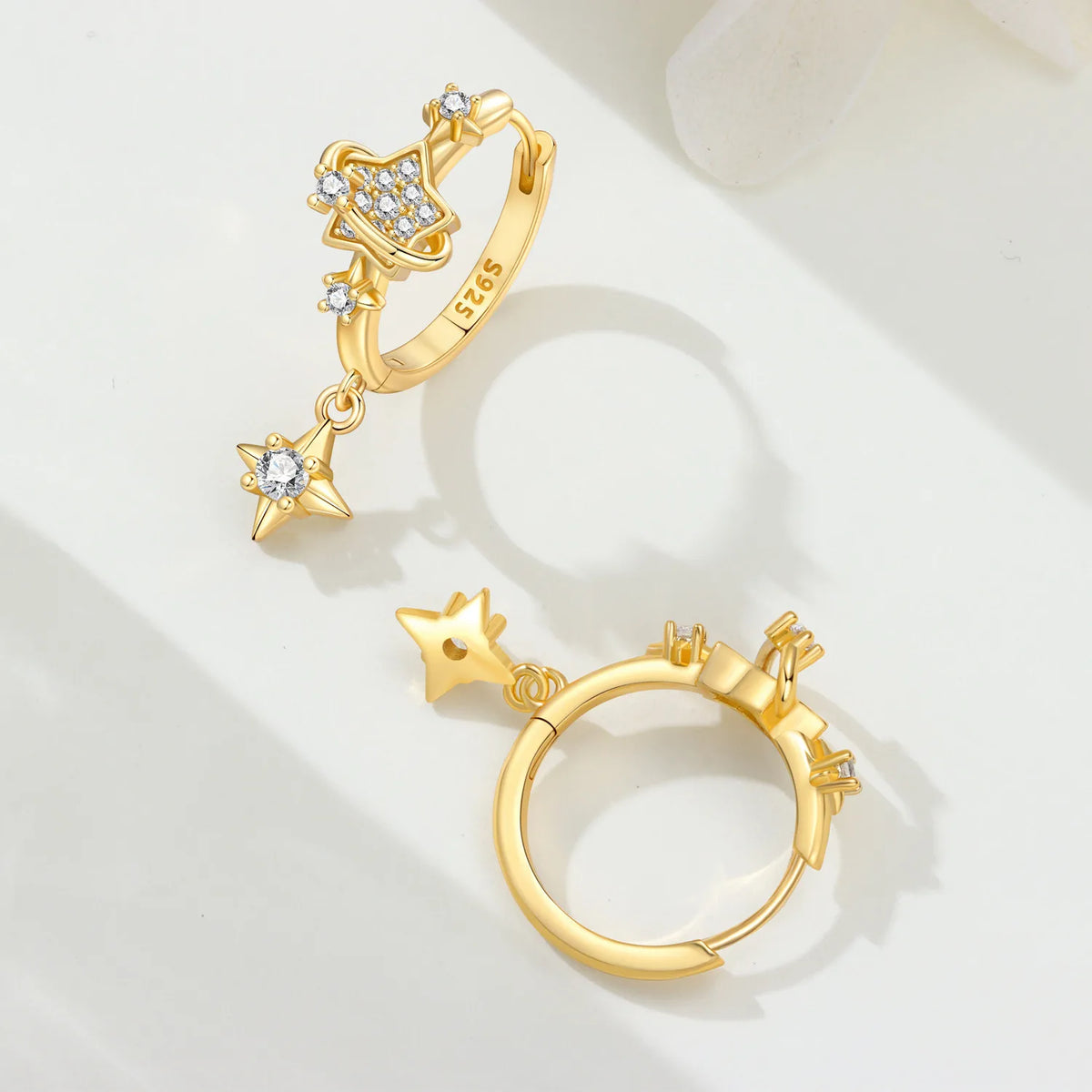 Sterling silver Orstarry earrings with star-shaped designs, featuring bright accents, from Corporación Turística.