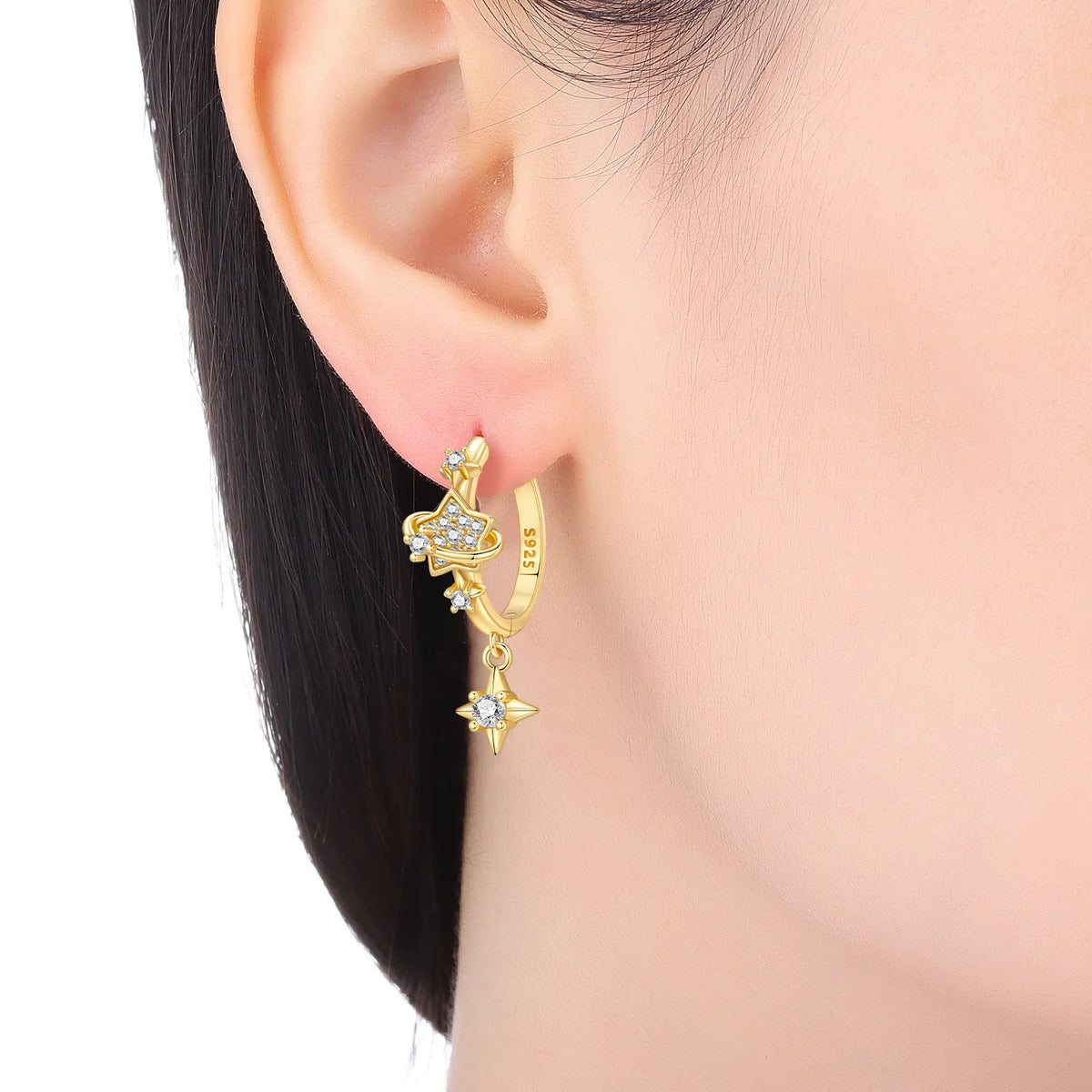 Sterling silver Orstarry star-shaped earrings with star details, crafted by Corporación Turística.