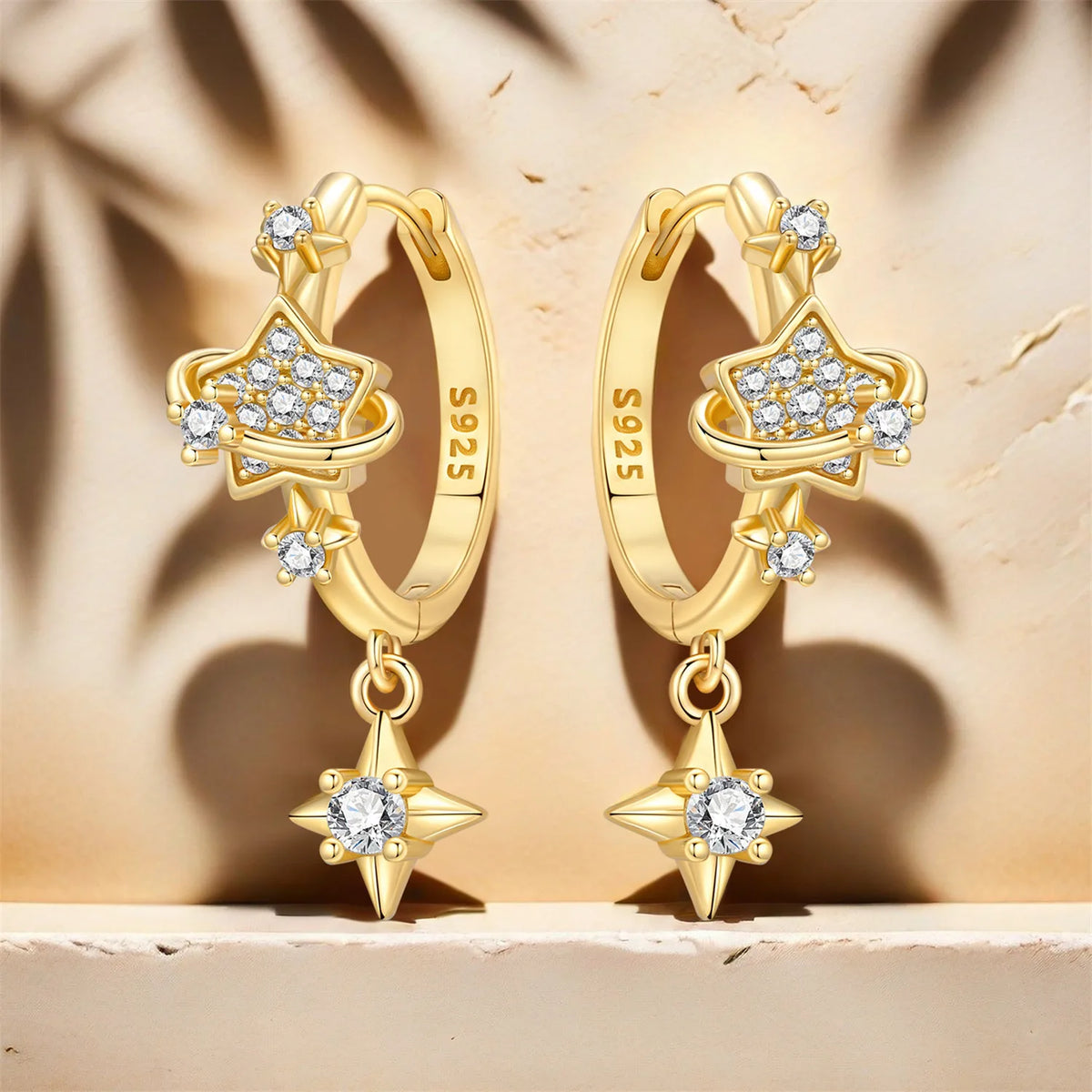 Sterling silver Orstarry earrings with star-shaped designs by Corporación Turística, featuring a shiny finish and intricate details.