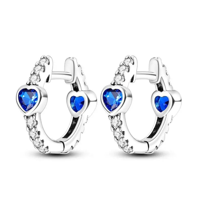 Sterling silver Orstarry earrings with blue zirconia stones, featuring elegant dangle design, crafted by Corporación Turística.