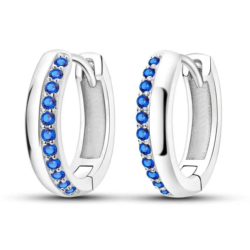 Sterling silver Orstarry earrings with blue cubic zirconia, featuring a delicate, elegant design.