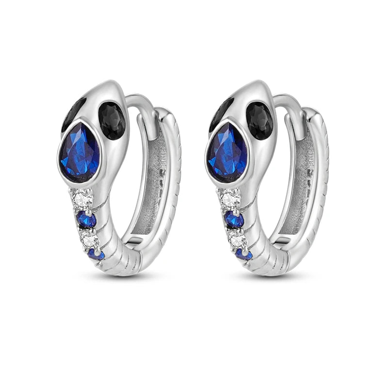 Sterling silver Orstarry earrings with blue cubic zirconia by Corporación Turística, showcasing elegant dangle jewelry.
