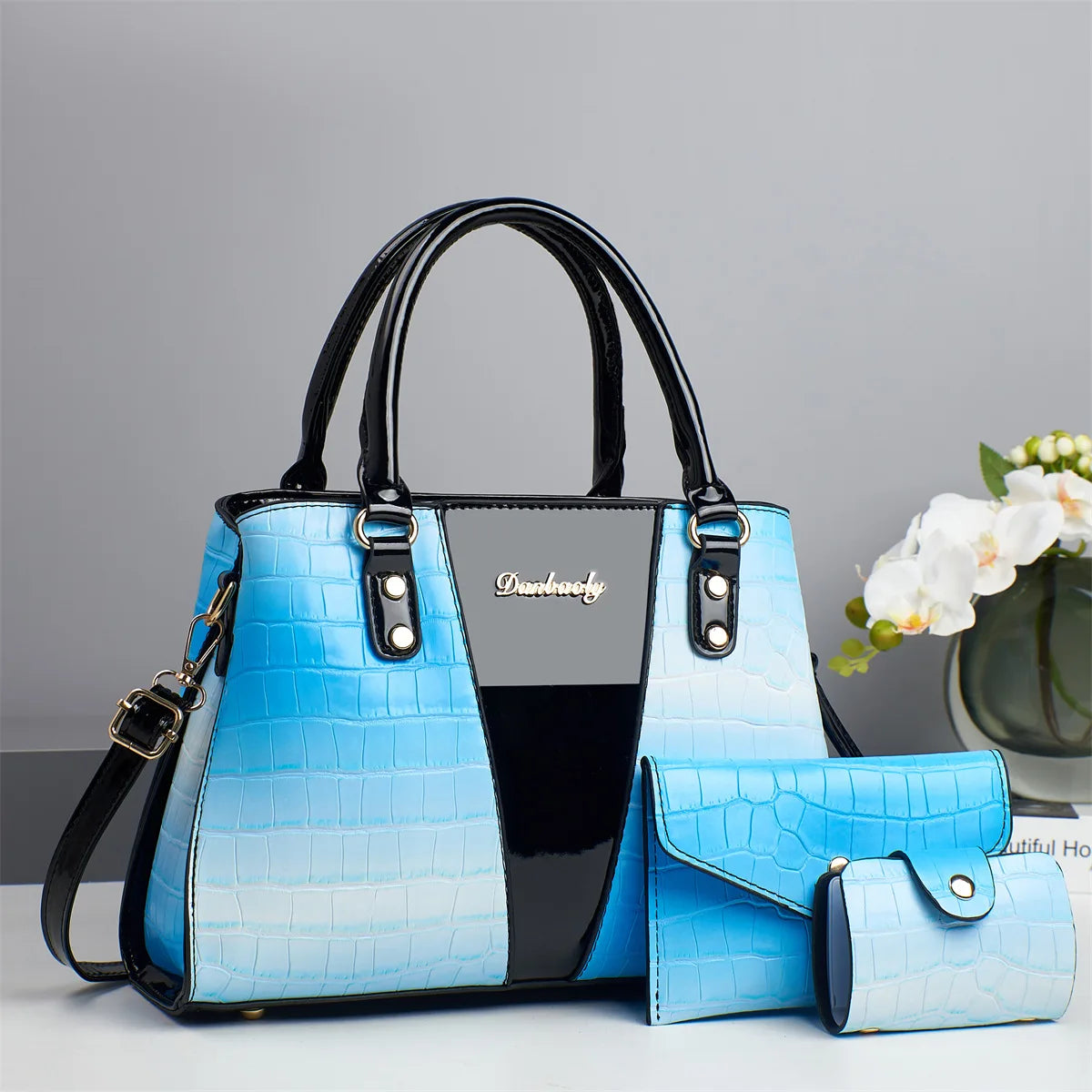 Luxury designer shoulder bag with a bandolera style, featuring elegant details and a sleek, structured design in vibrant colors.