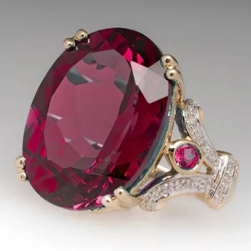 Exquisitos anillos ovalados de Corporación Turística con incrustaciones de circón, mostrando detalles de diseño y brillo en la imagen.