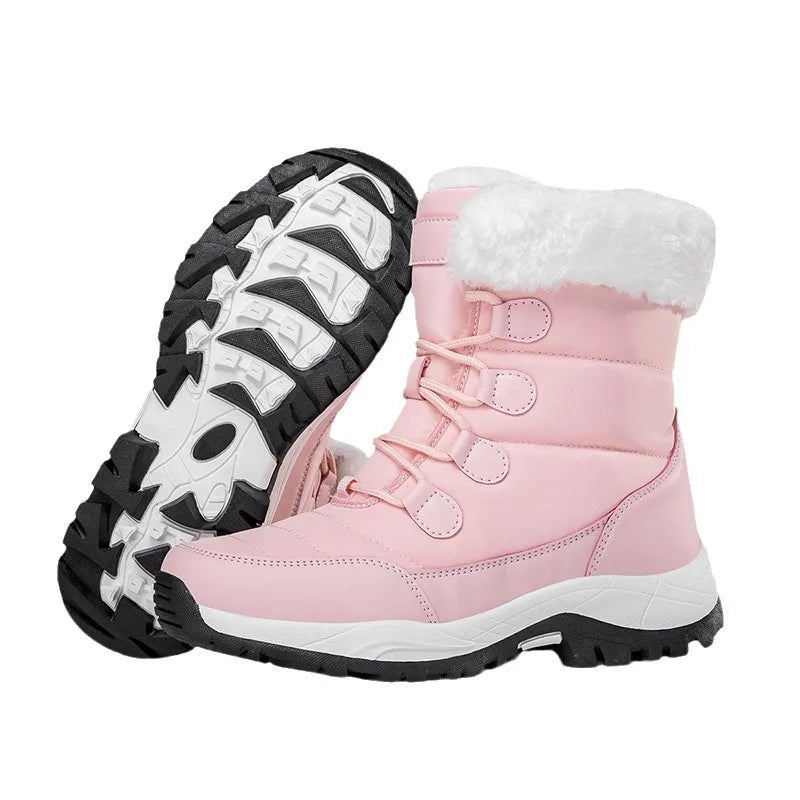 Pink cotton ankle-high snow boots from Corporación Turística with high warmth and cozy winter style.