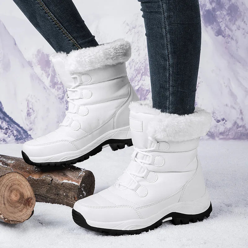 Pink ankle-length cotton snow boots from Corporación Turística, high warmth and cozy design, ideal for winter wear.
