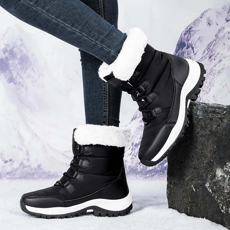 Pink cotton ankle-height snow boots by Corporación Turística with high warmth and cozy winter design.
