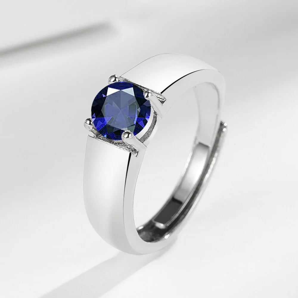 Sterling silver 925 men's moissanite ring with pink accents, featuring a sleek design and polished finish.