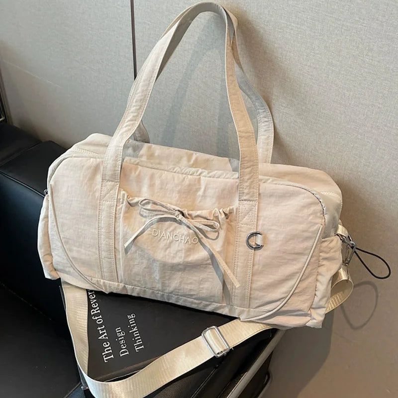 Large pink gym bag from Corporación Turística for yoga, travel, and hiking, with multiple compartments and durable fabric.