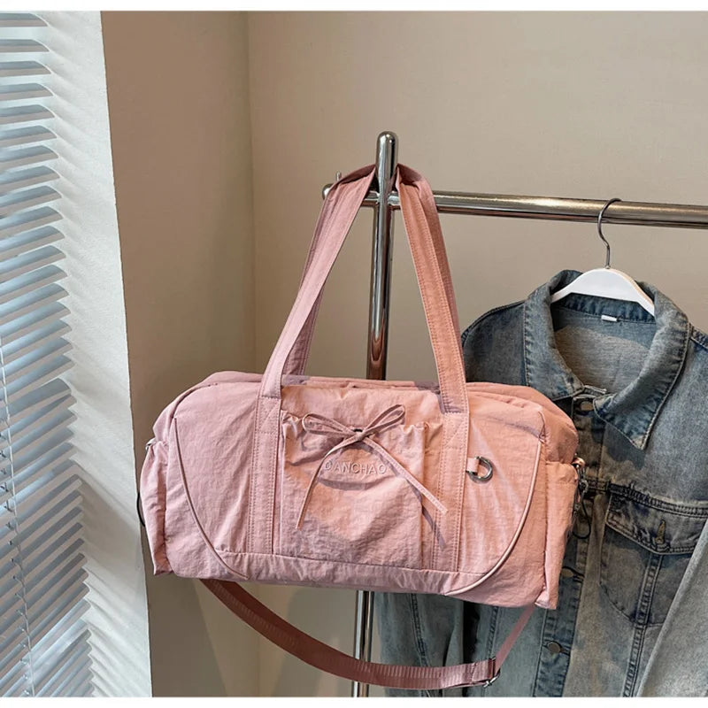 Large gym bag by Corporación Turística, pink yoga, travel, and hiking bag with multiple compartments and sturdy handles.