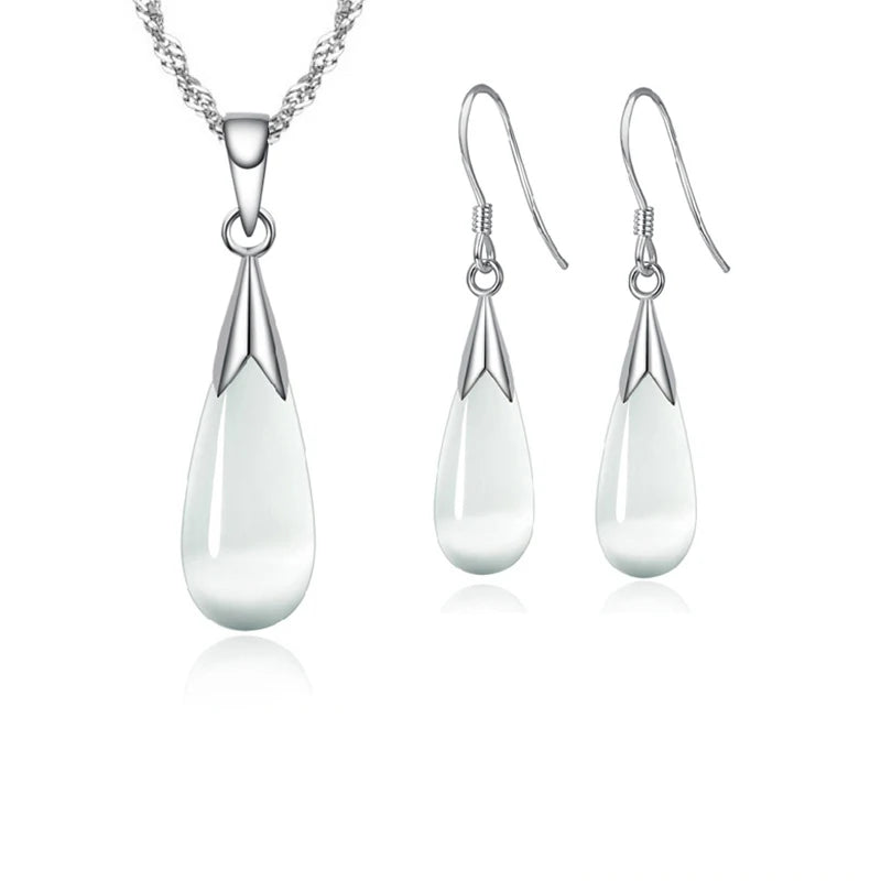 Elegant pink jewelry set by Corporación Turística featuring simple sterling silver 925 pieces with a sleek, minimalistic design.