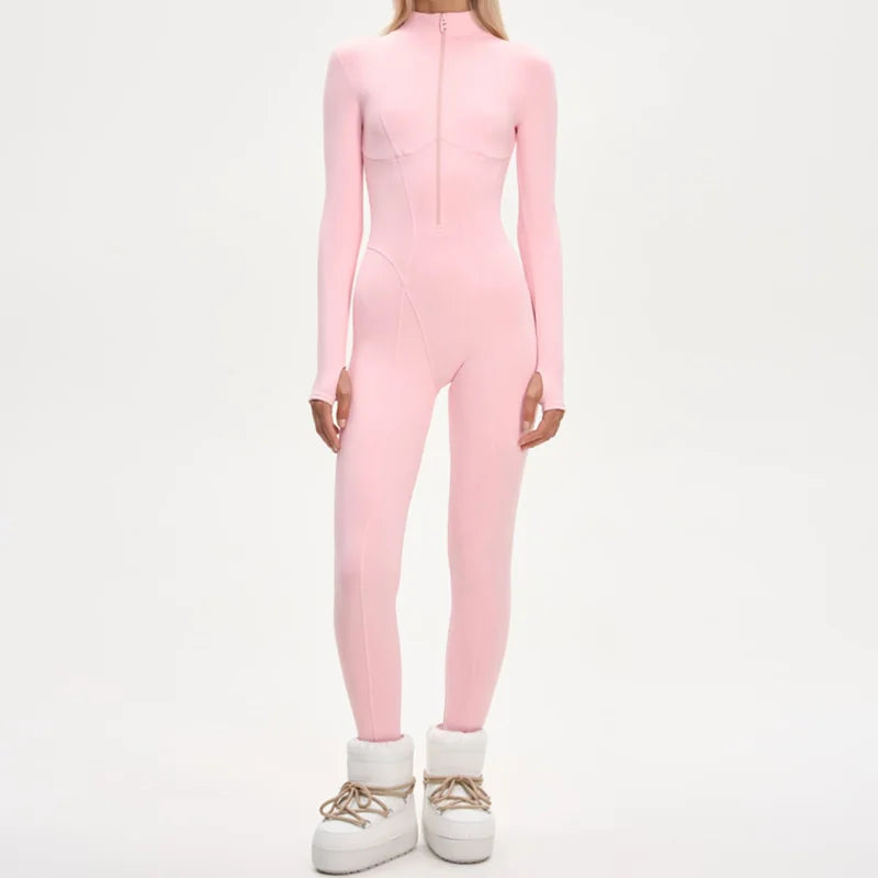 Pink women's ski jumpsuit made of thick leather by Corporación Turística, featuring a sleek and elegant winter ski suit design.