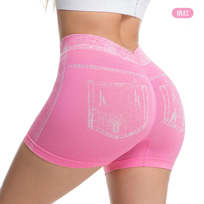 Pink denim-effect sports shorts for women by Corporación Turística, featuring a casual, comfortable fit and stylish design.